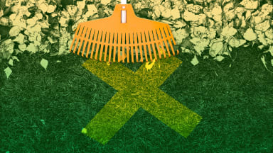 A rake pulls away leaves to expose an X.