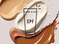 Foundation and sunscreen splotches on a blush background