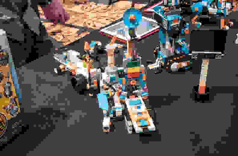 This robot can be programmed to build little models out of Legos.