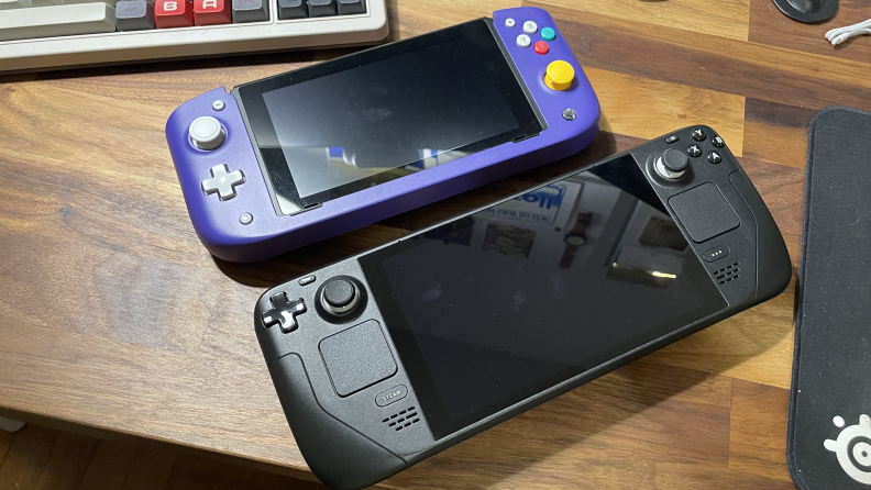 The CRKD Nitro Deck next to another Nintendo Switch.