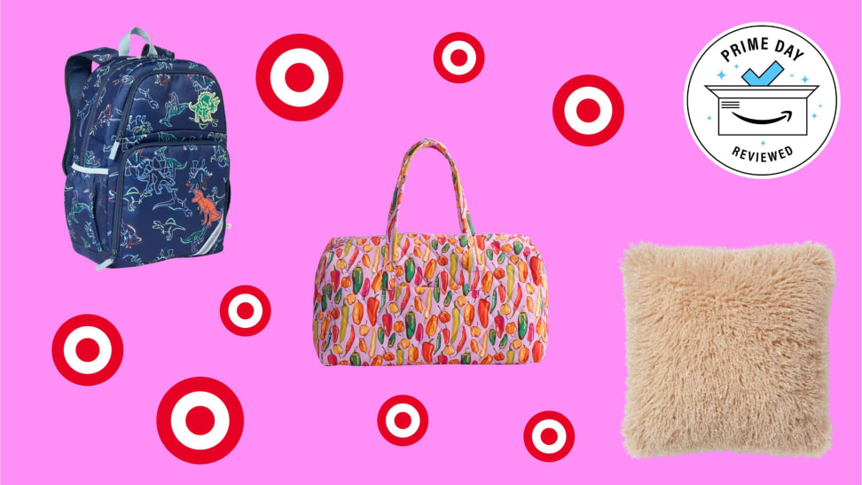Bags and a pillow with Target logos in front of a pink background