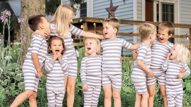 group of kids in matching striped grey and white pjs