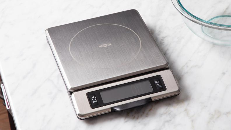 OXO digital kitchen scale on a marble surface