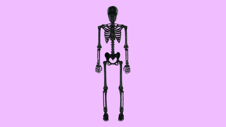 An image of a tiny black skeleton decoration.