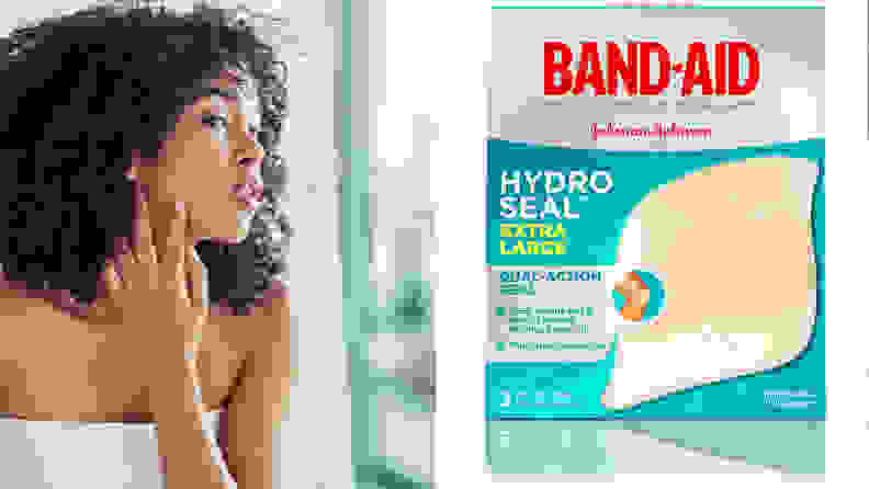 Woman looking into the mirror worried while touching her face / Box of Band-Aids