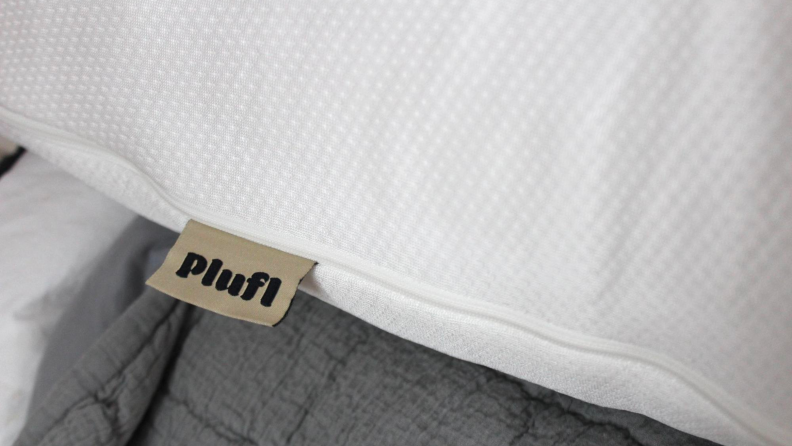 A close-up of the Hugl’s cover, with a tag that reads Plufl.