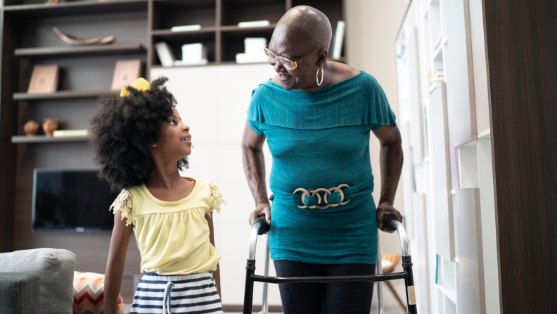 A young girl and her grandmother chat.