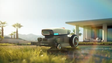 A robotic law mower moving across the lawn.