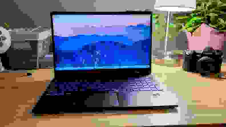 An open laptop sitting on a desk