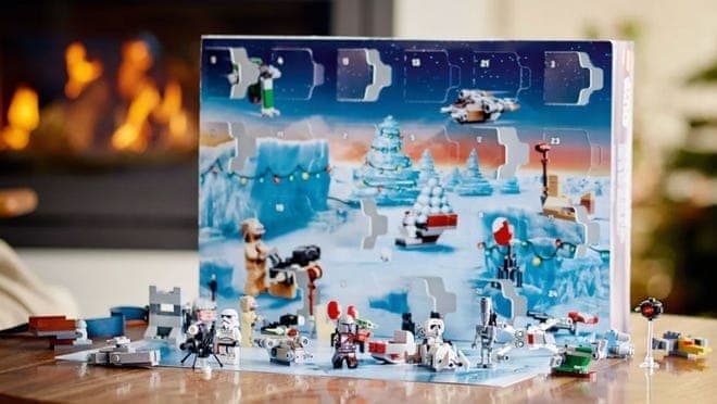 Star Wars themed advent calendar in front of fireplace.