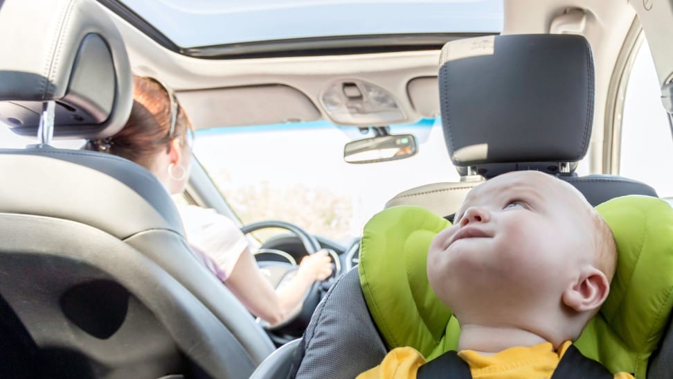 Boy in car seat riding in car