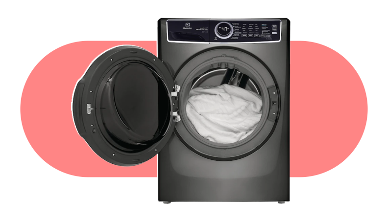 The Electrolux washing machine with the door open and white laundry inside.