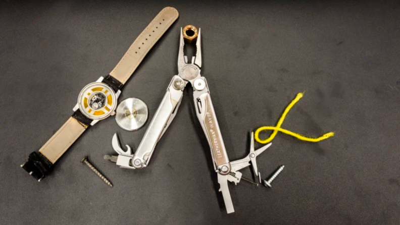 A multitool against a gray background.