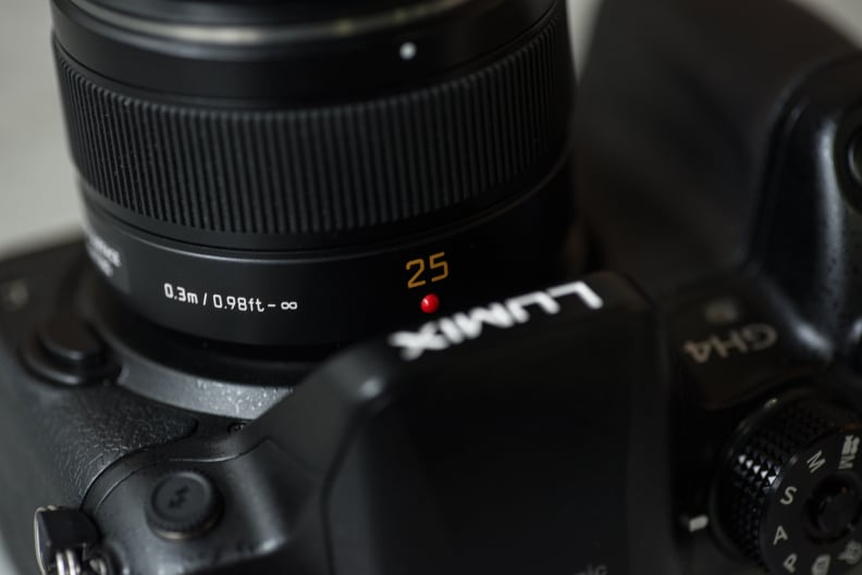 On the Four Thirds sensor, 25mm is equivalent to a 50mm lens on film or a full-frame sensor.