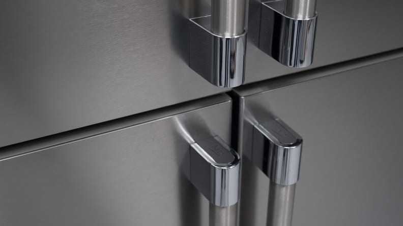 A close-up of the exterior handles on the fridge's four doors.