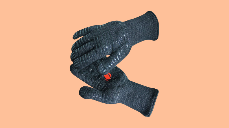 Grill Heat Aid Extreme Heat Resistant Grill Gloves on a peach background.