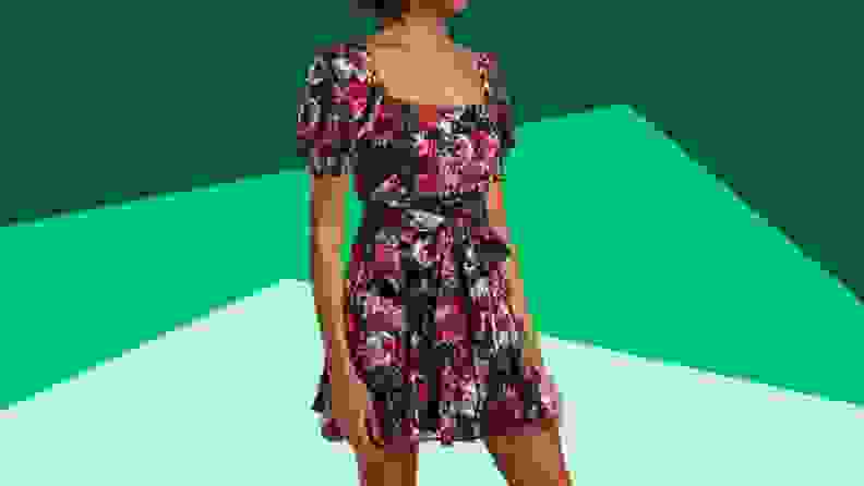 A model wears a floral minidress.