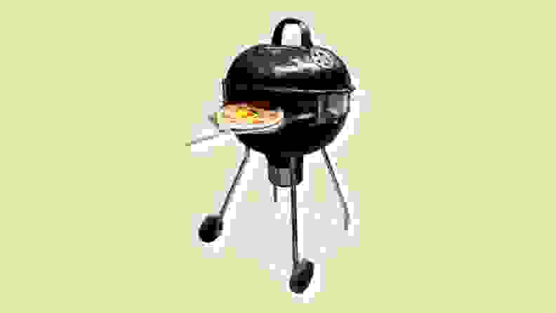 A pizza on a grill on a beige background
