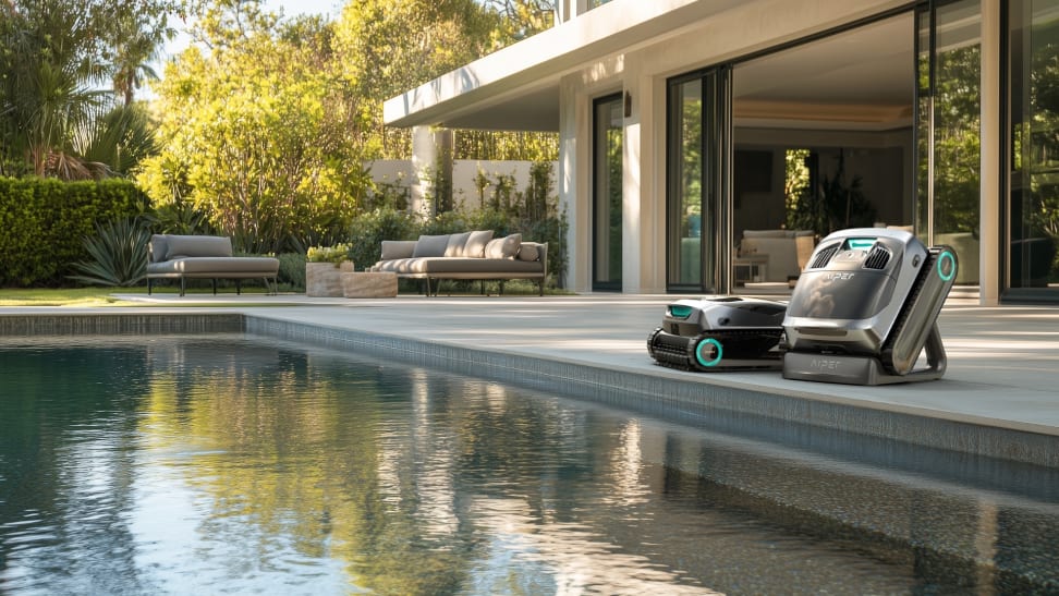 Aiper Scuba X1 and Scuba X Pro Max robotic pool cleaners sitting on the edge of an in-ground pool