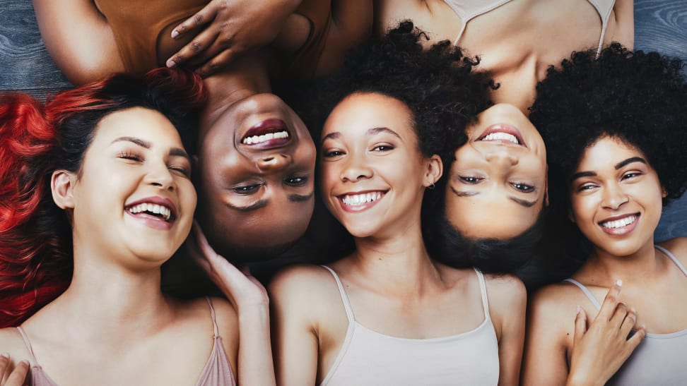 Five women with curly hair