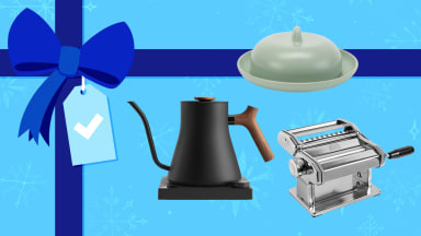 A teapot, butter dish, and pasta maker on a blue gift background