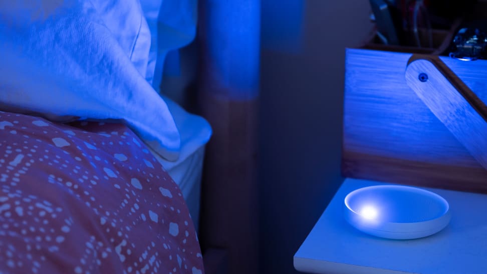 the dodow illuminates a nightstand and bed