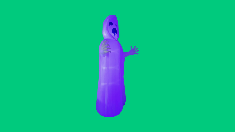 A purple ghostly Halloween blow up floats on a green background.