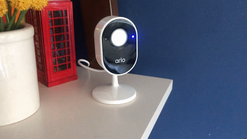 A GIF that shows the camera privacy shield opening and closing on the Arlo Essential Indoor Security Camera.