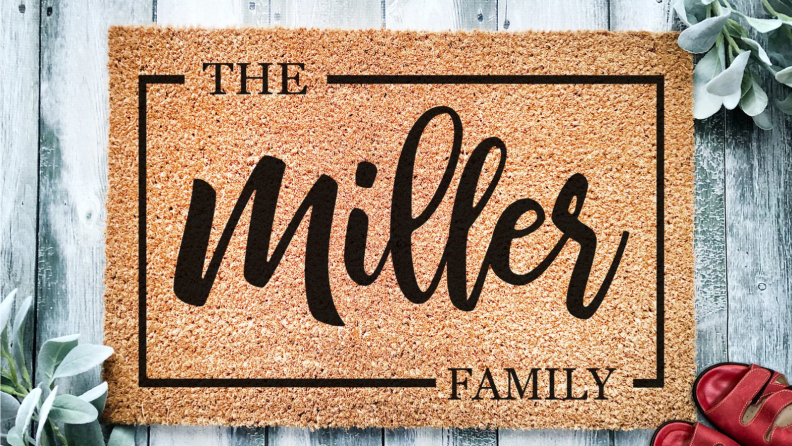 An image of a personalized doormat that reads "Miller" in black, swirling text.