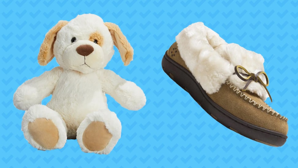 A stuffed dog and a slipper on a blue background