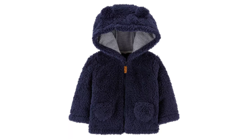 An image of a dark blue sherpa jacket with tiny pockets and a hood.