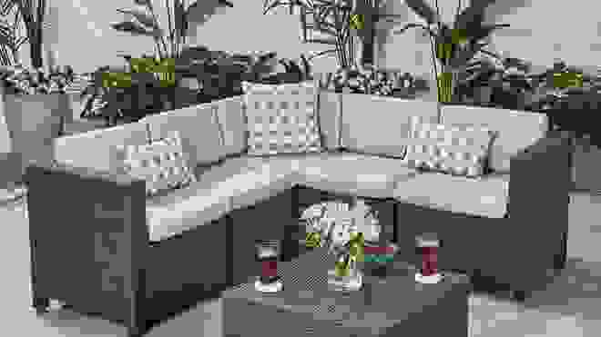Black patio furniture with light gray cushions