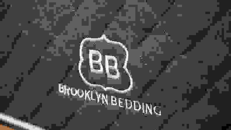 the Brooklyn Bedding logo embroidered in white on a dark blue background