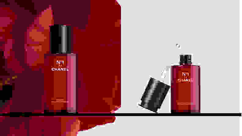 On the left: A red bottle of serum with a red flower in the background. On the right: A red bottle of serum uncapped with the dropper to the side of the bottle.
