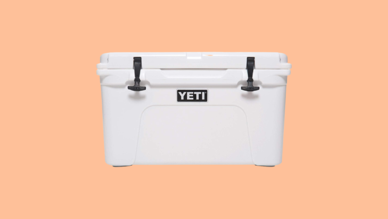 Large, white cooler against orange background