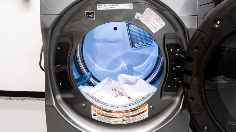 A shot of the LED-lit interior of the Whirlpool WED9620HC's drum, with a white sheet lying at its bottom for scale.