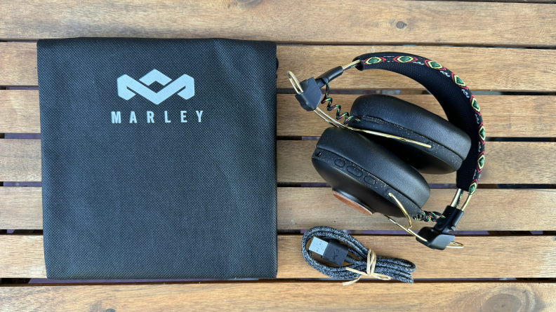 The Marley Positive Vibration Frequency Headphones next to a case and accessories for the headphones.
