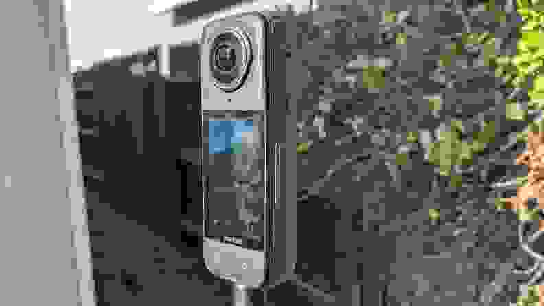 A side view of screen and camera on the Insta360 X4 Action Camera outdoors.