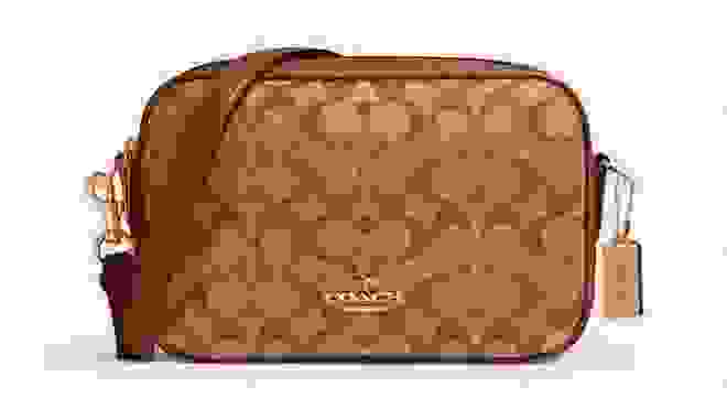 Leather bag in various shades of brown with Coach pattern