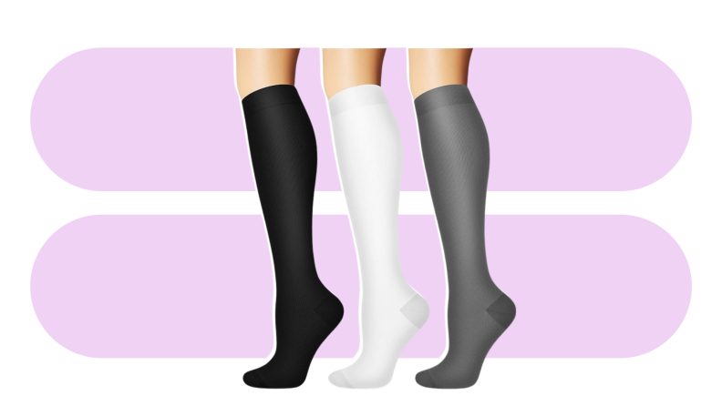 Three tall socks, black, white, and gray, against a purple background.