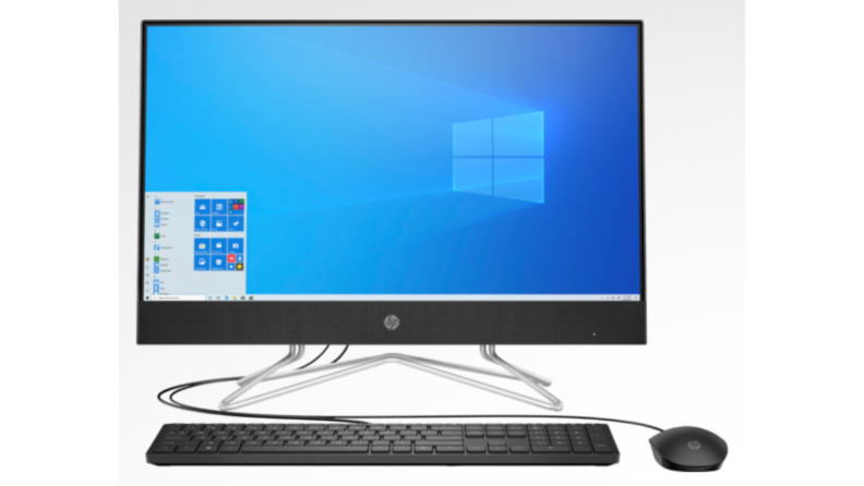 An image of the HP all-in-one with a blue Windows screensaver and a keyboard and mouse.