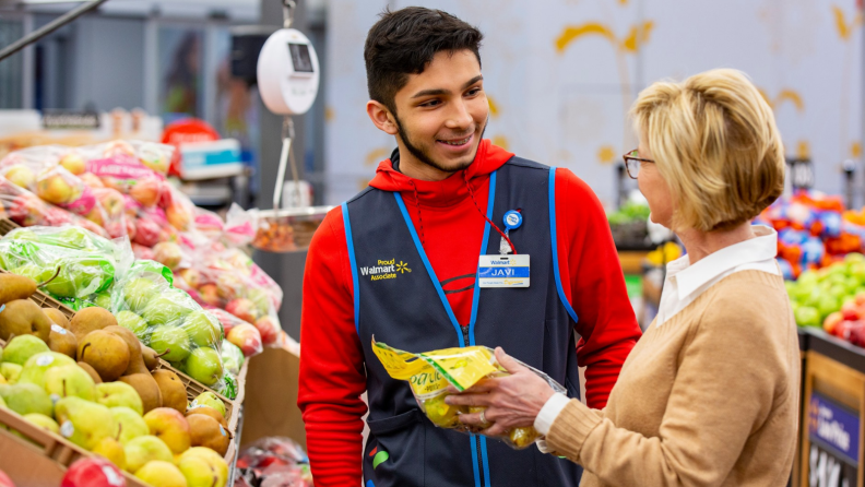 A Walmart employee and customer.