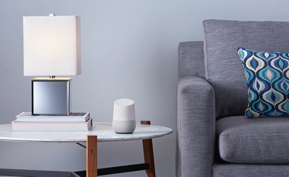 Google Home sitting on an end table in a living room