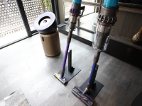 New Dyson products on display, including an air purifier and two cordless vacuums