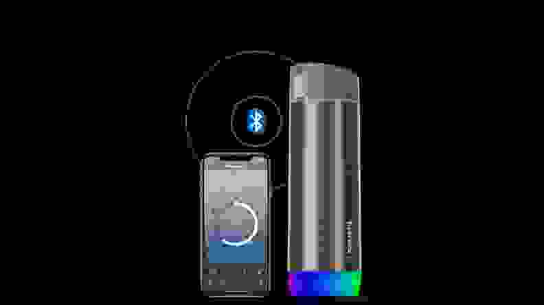 The Hidrate Spark smart water bottle is displayed next to a shot of the Hidrate smartphone app.