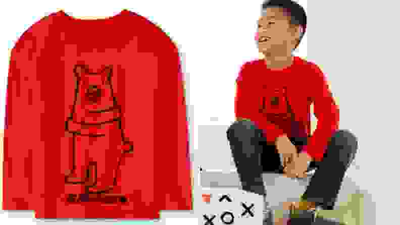 Red long sleeved children's shirt with bear stitched on front.