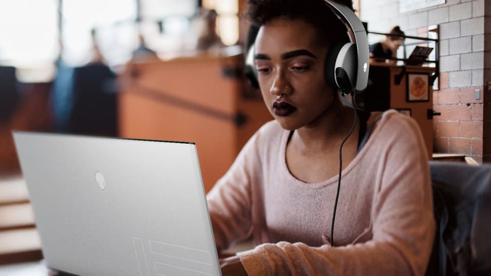 A person using a gaming laptop