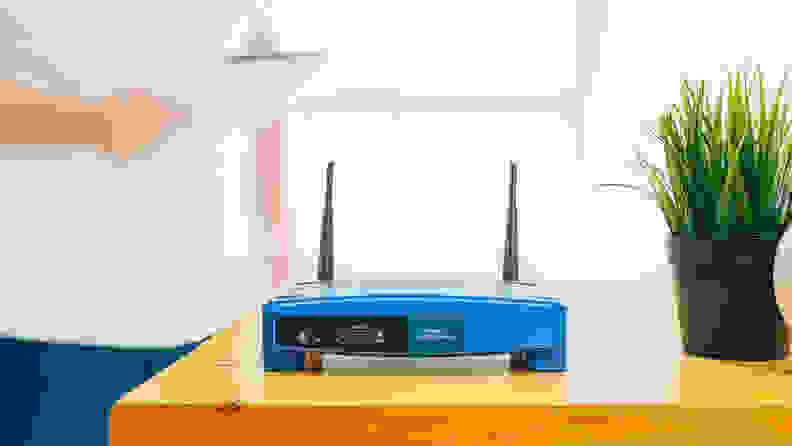 An image of a blue router on a table