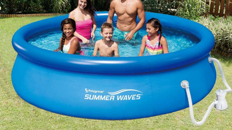 Family sitting in an above ground pool