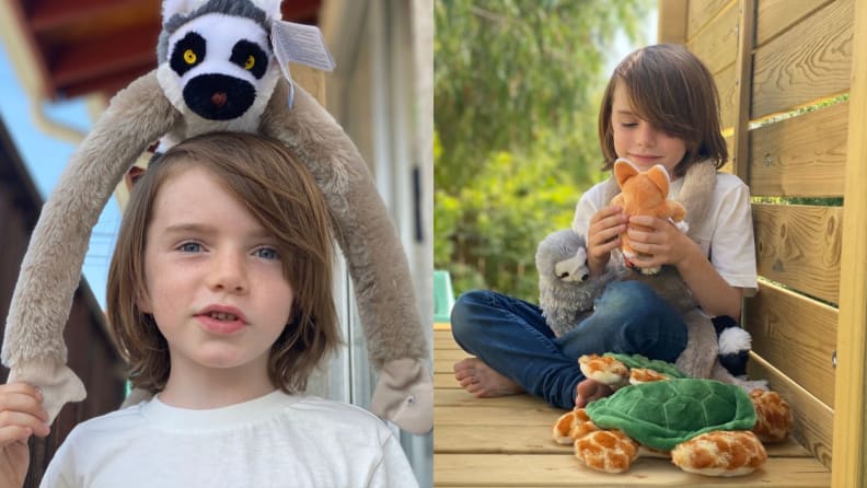 A child plays with wild animal kingdom stuffed animals